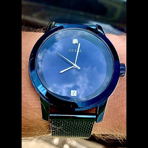 Diamond embedded Sterling Silver GUESS watch.